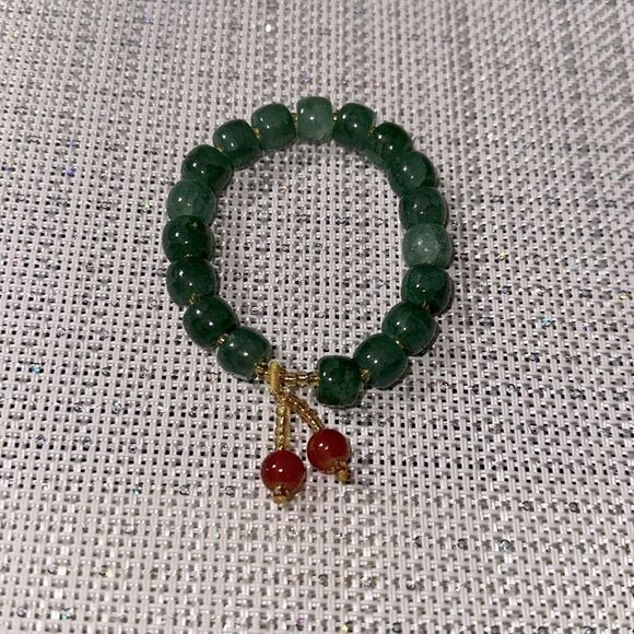 Handmade Green Jade Stretch Bracelet with Small Rust Tasseled Design - Picture 3 of 4